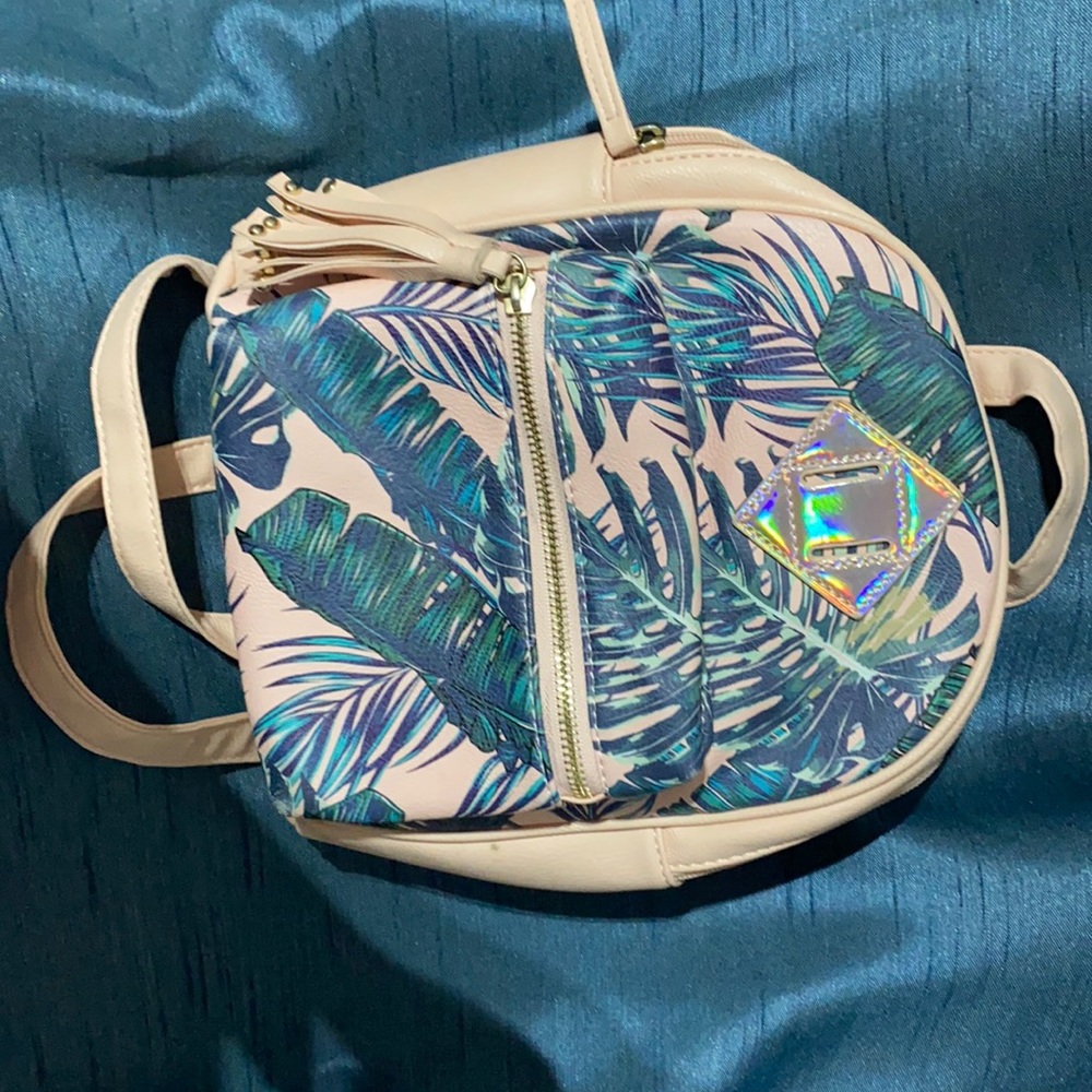 I have this cute mini backpack purse .